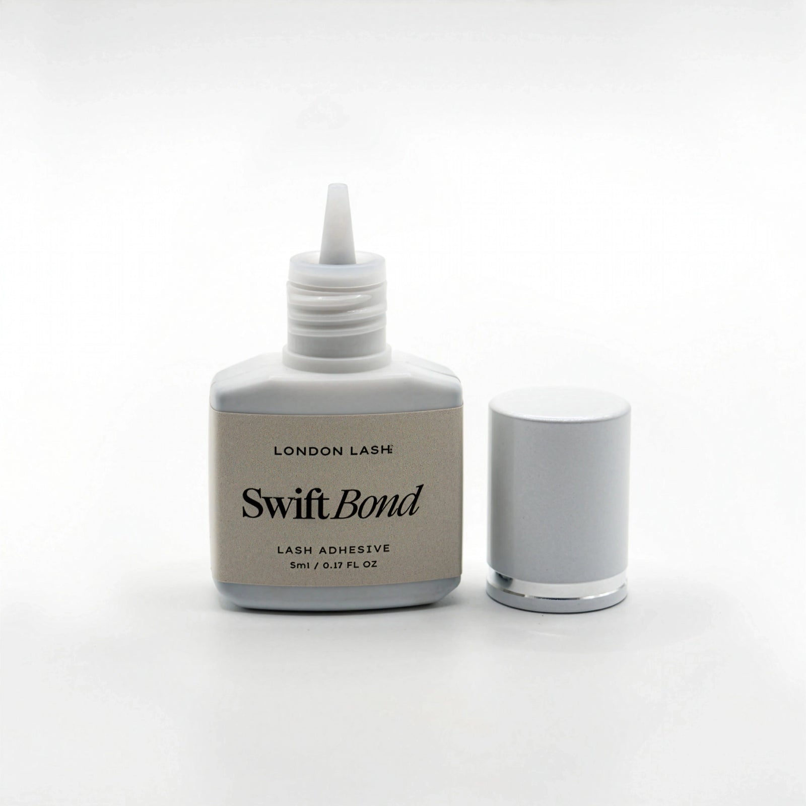 Bottle of London Lash Swift Bond lash adhesive on a white background