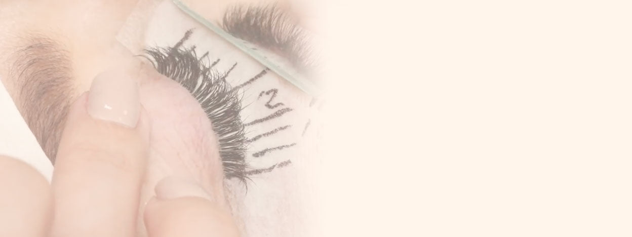 Lash Technicians applying eyelash extensions to natural eyelashes