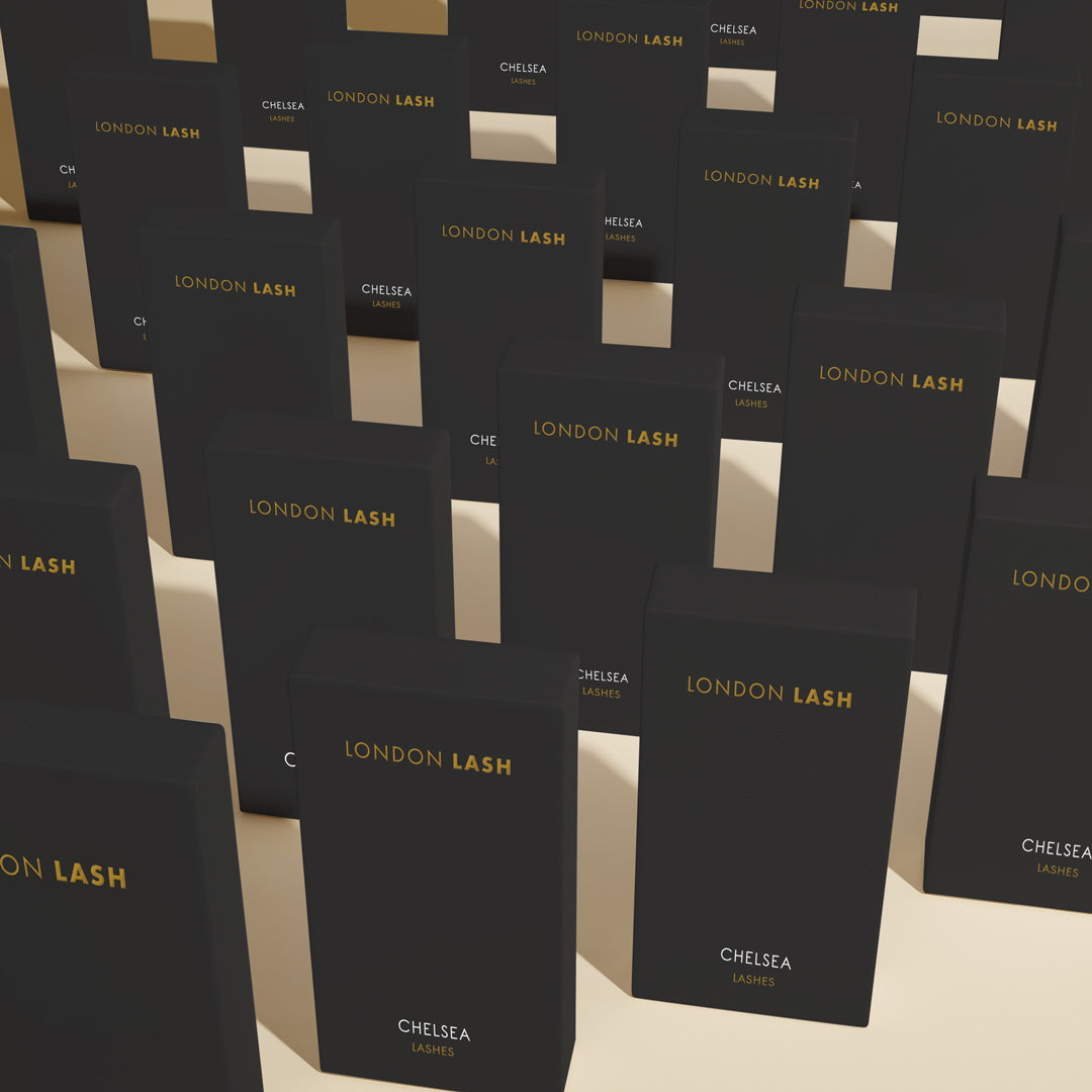 many black london lash extension trays standing in a few rows