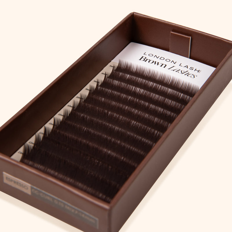 cruelty free synthetic dark brown eyelash extension inside an opened eco lash tray