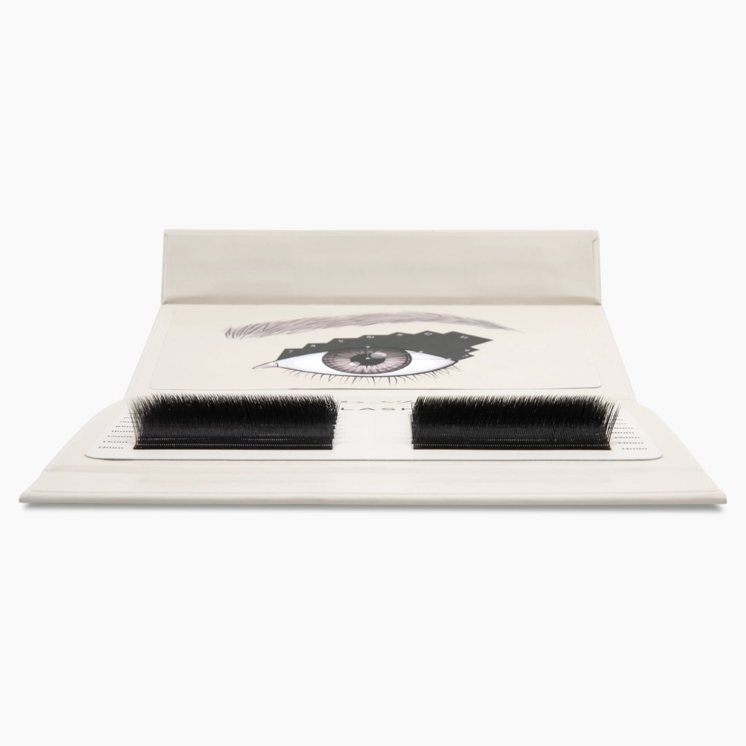 Low-angle front view of the open Lash Showcase showing the density and curl profile of the black Kitten Lash strips