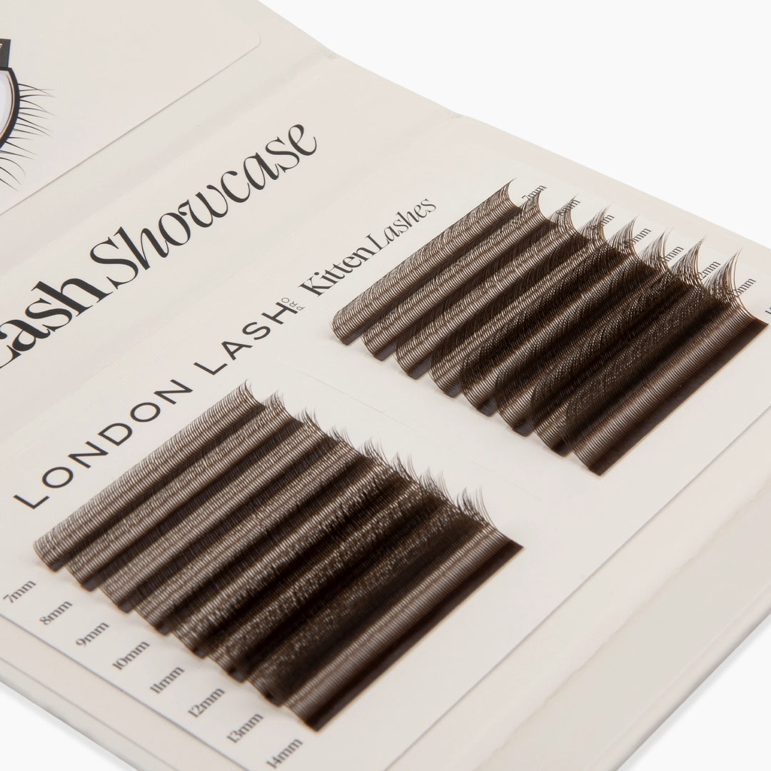 Top-angled perspective of the beige London Lash Showcase palette filled with two columns of brown Kitten Lash strips ranging from 7mm to 14mm.