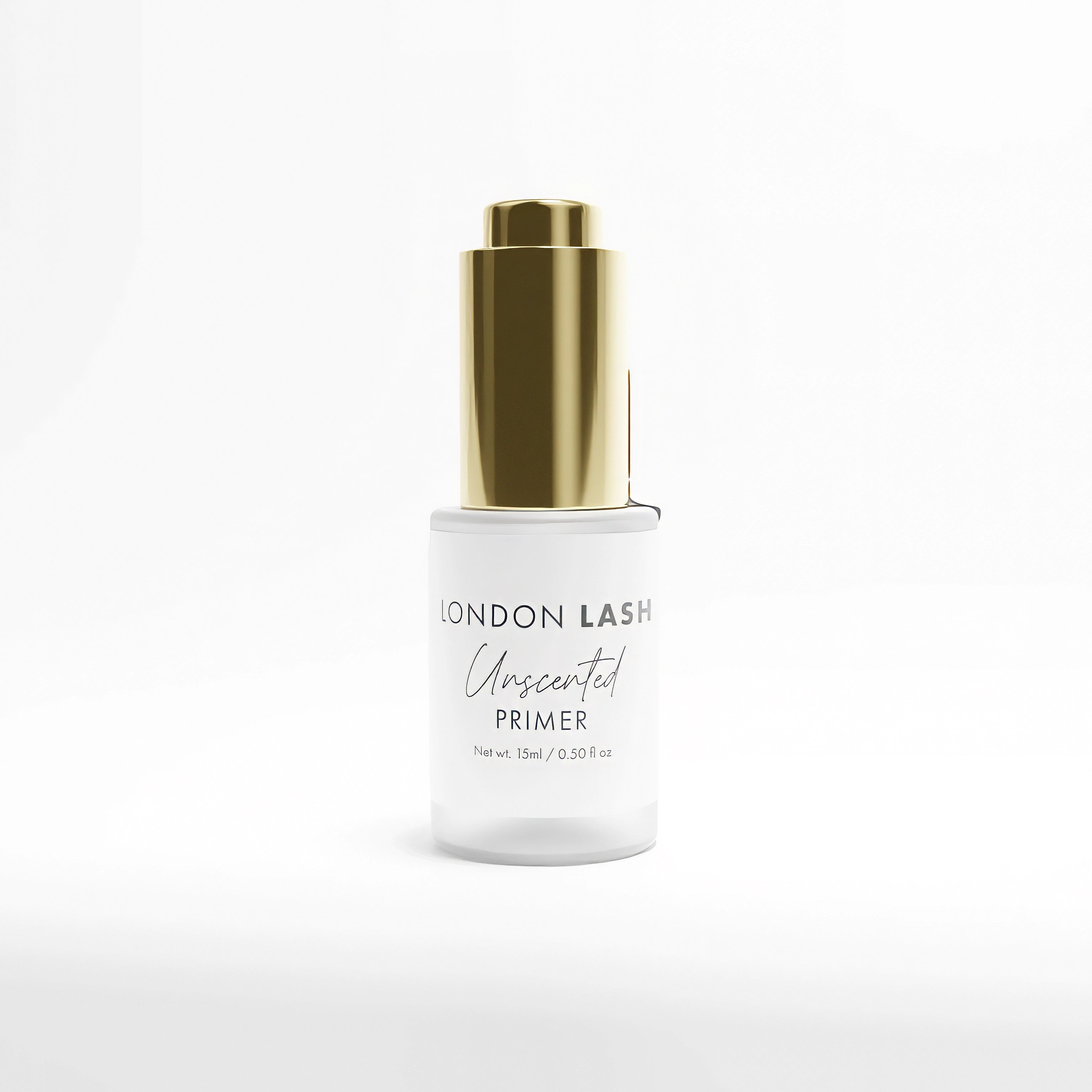 Eyelash primer bottle with gold cap on a white background