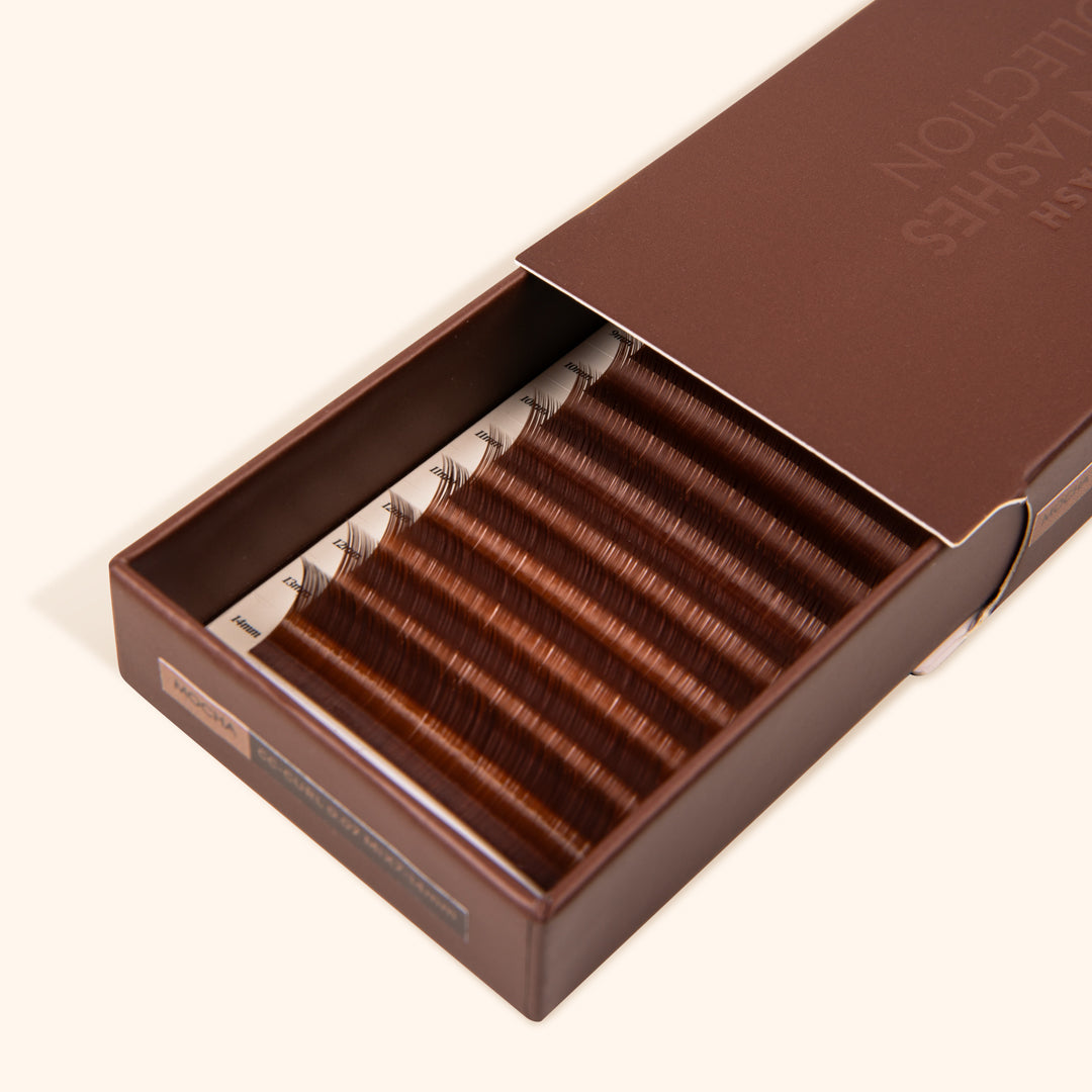 half opened eyelash extension tray with mocha shade brown synthetic eyelashes