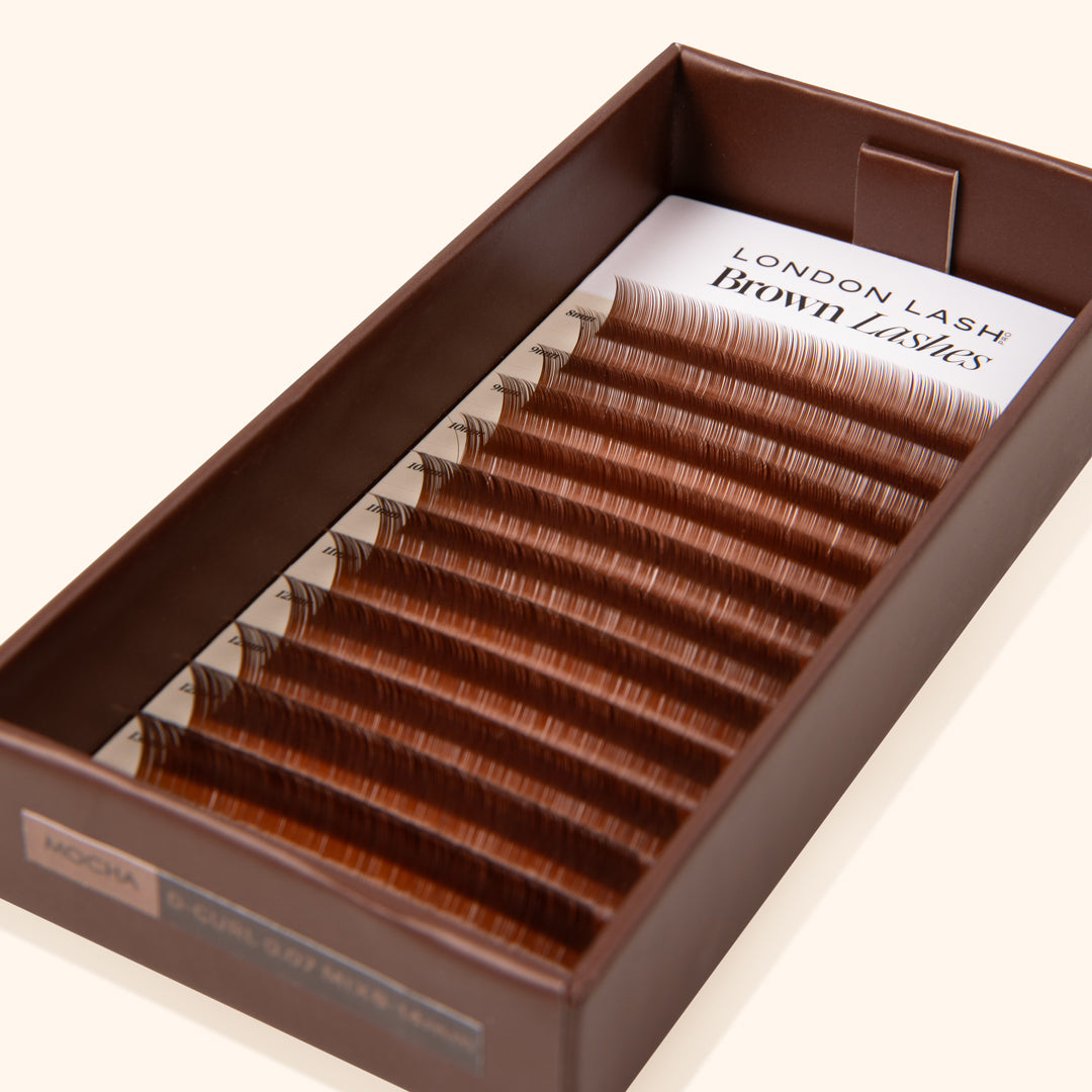 mocha brown eyelash extensions inside an opened eco lash tray