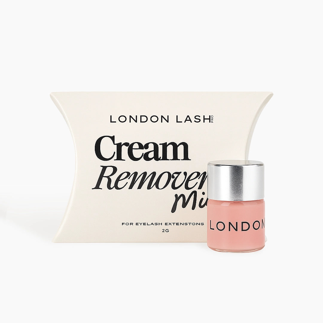 Pink mini cream remover with silver cap on a white background