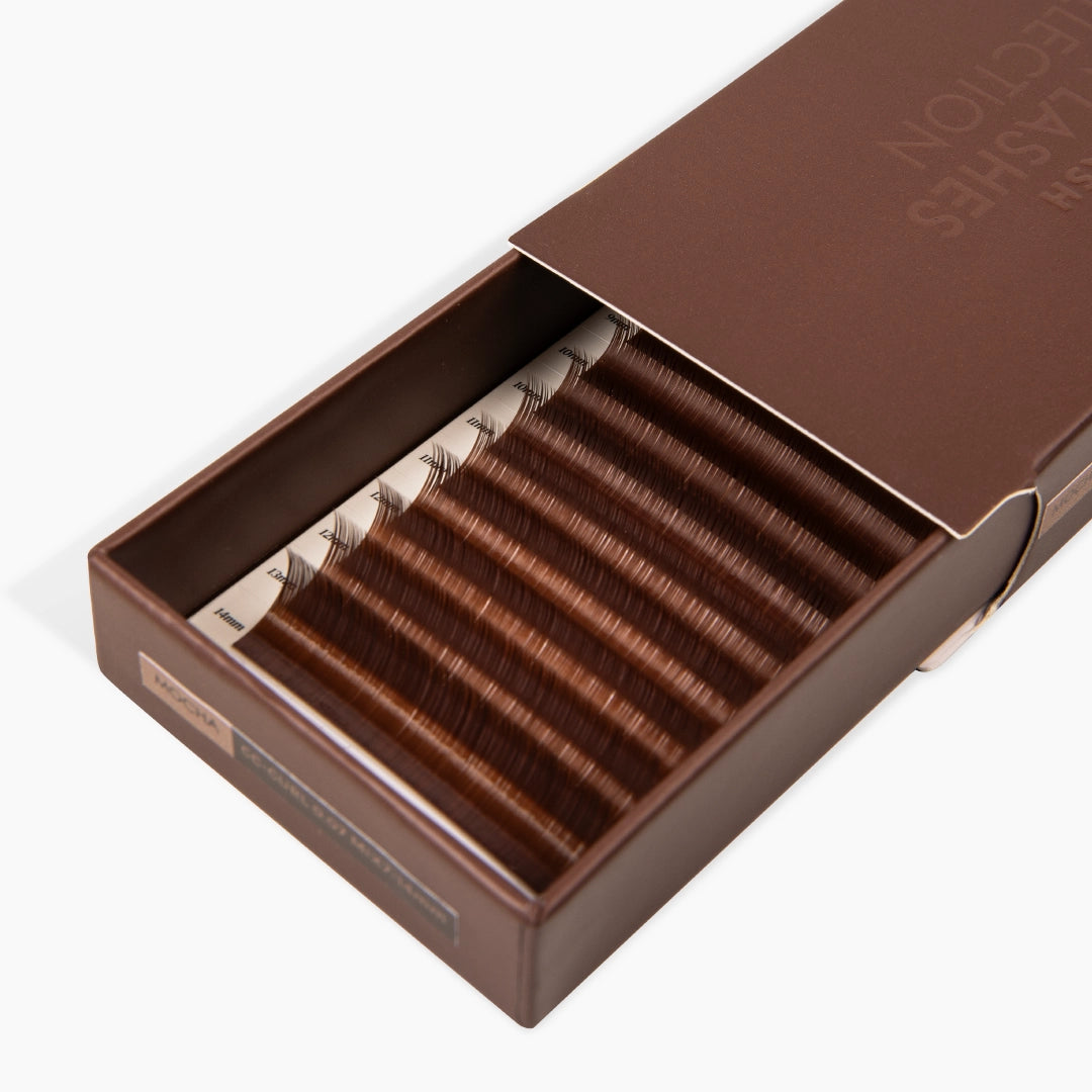 half opened eyelash extension tray with mocha shade brown synthetic eyelashes