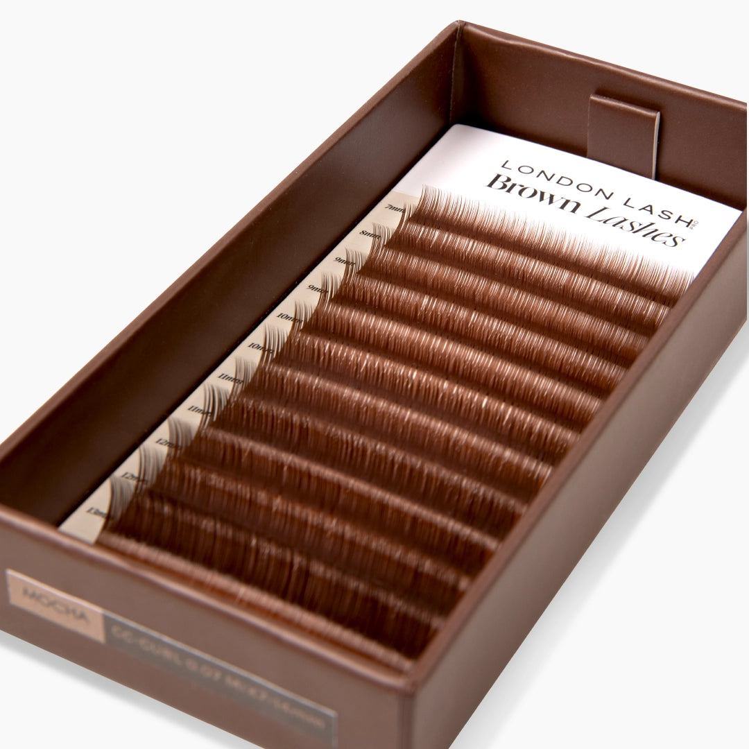 Mocha toned eyelash extensions inside open London Lash brown lash tray