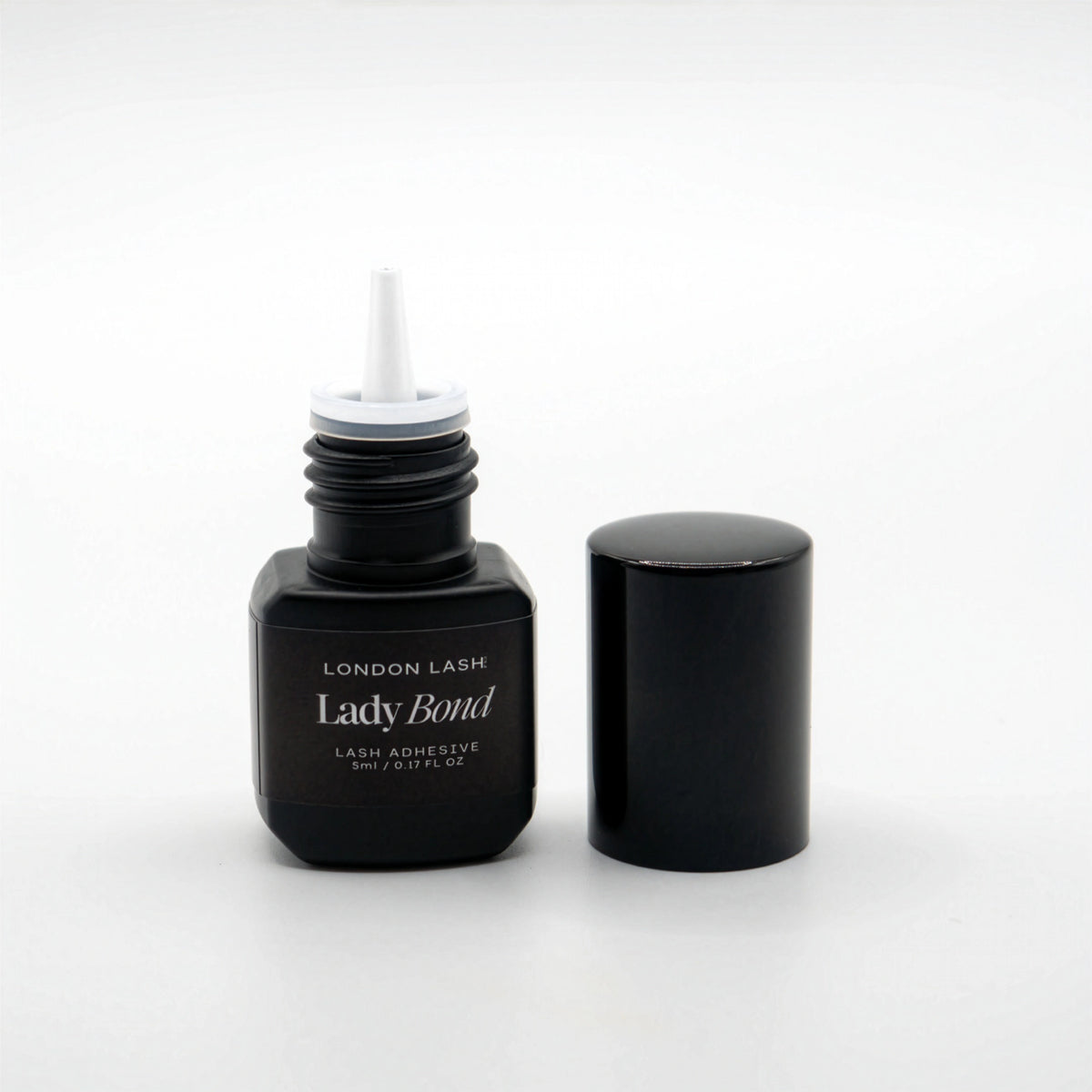 Black eyelash adhesive bottle with 'London Lash Lady Bond' text on a white background
