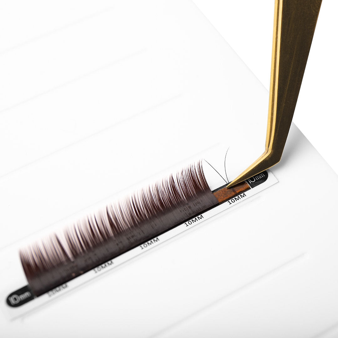 brown eyelash extensions in 0.10 being fanned with fine tip volume tweezers